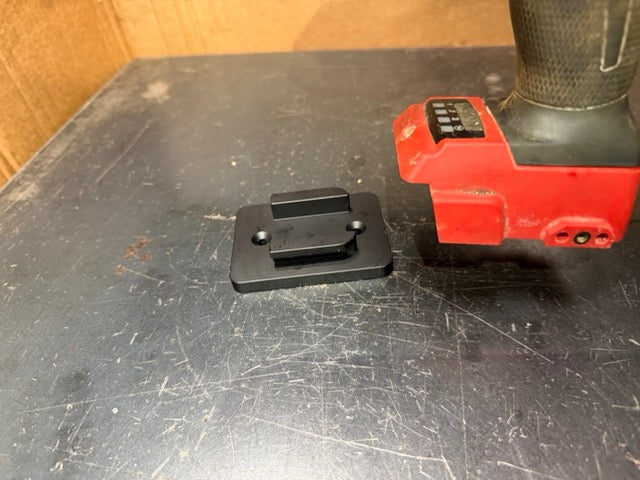 Keepfast tool holder plate next to a Milwaukee M18 impact wrench